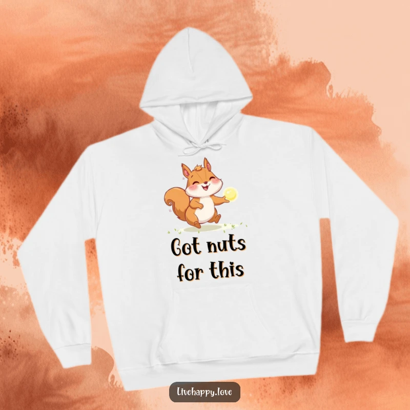Funny Squirrel Hoodie: Depicts a joyful squirrel with puffed cheeks, energetically chasing a bright, sparkling orb of light with determination.
