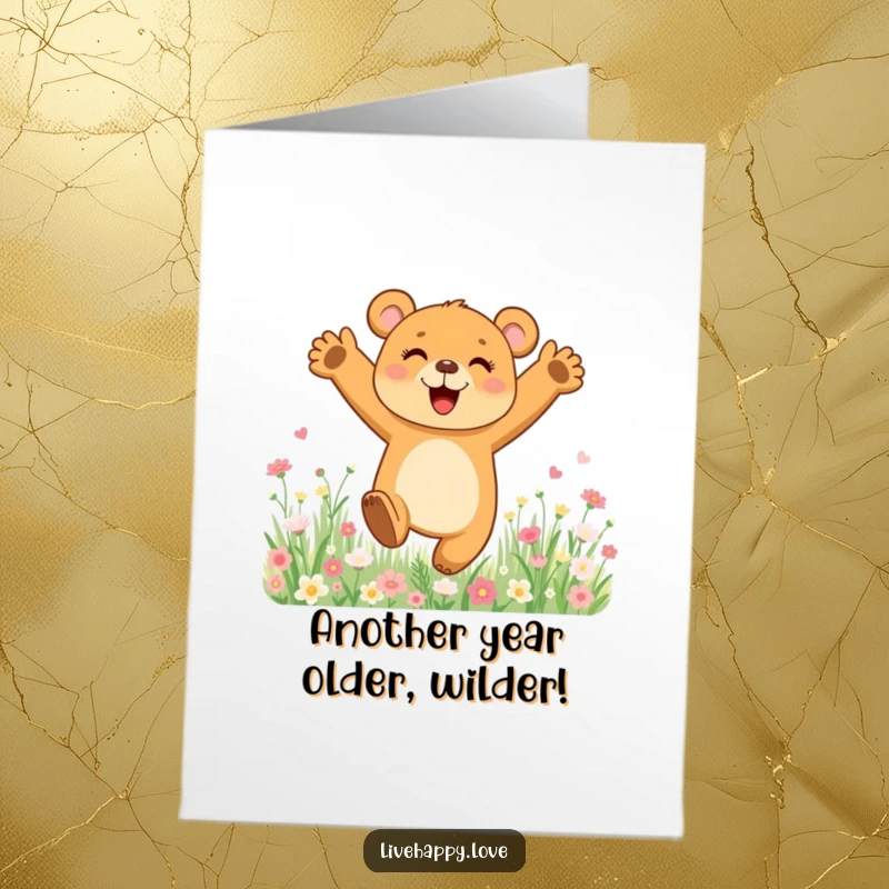 Funny Free Printable Birthday Card: Joyful bear cub with arms outstretched leaping in a field of flowers.