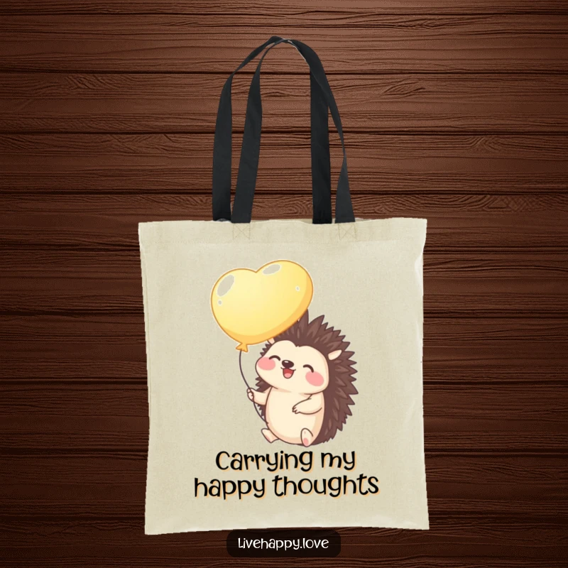 Funny Hedgehog Tote Bag: A giggling hedgehog holding a bright balloon floats gently upwards, symbolizing dreams taking flight.